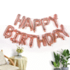 Ballons "Happy Birthday" en rose gold pour une fête élégante